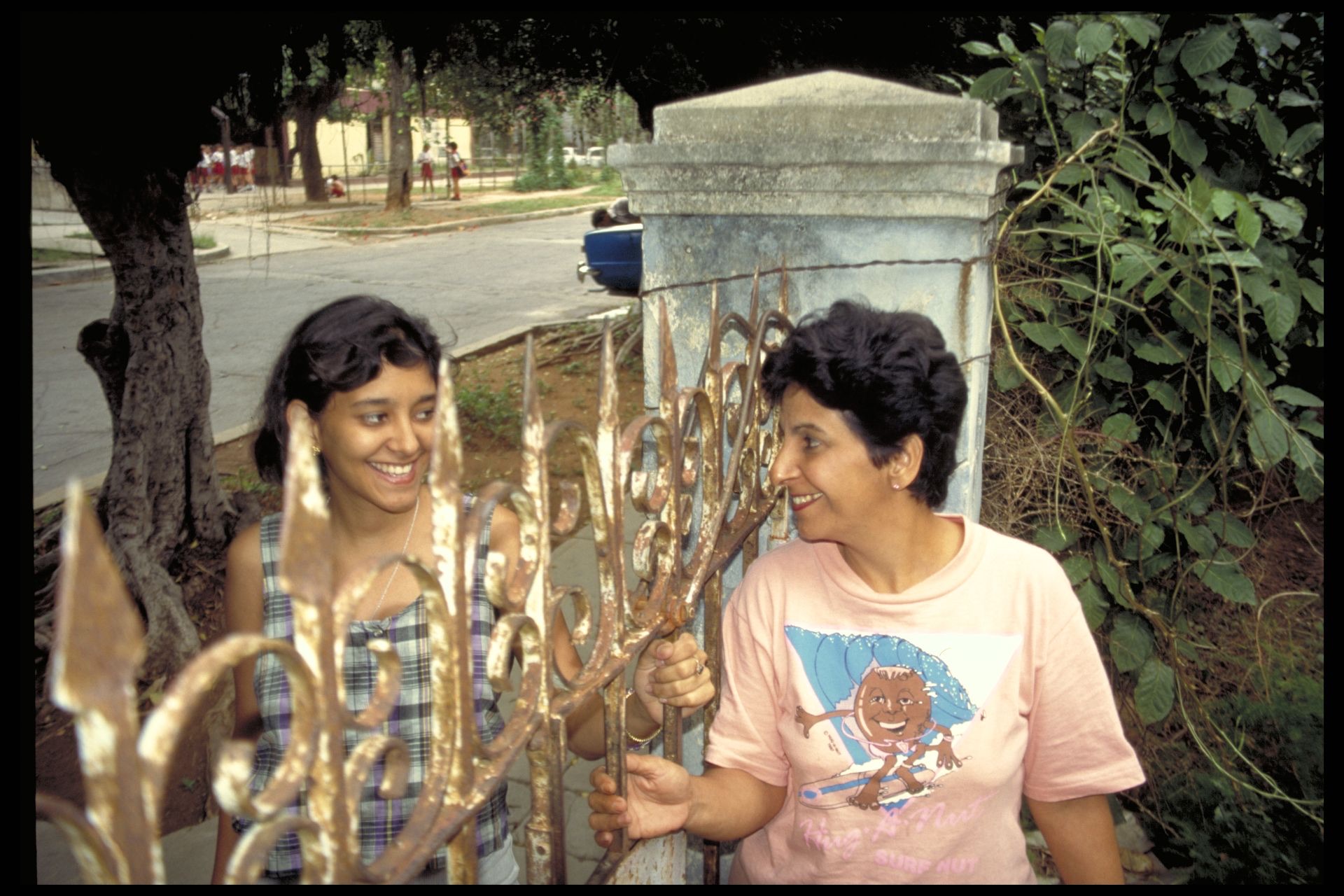 Salma de la Carida Chediak and her daughter Vivian at the gate of their house